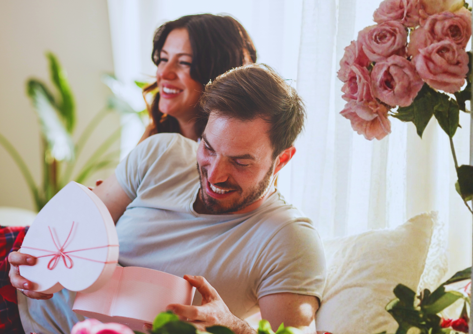 Valentine’s Day surprise gift shared between couple at home.