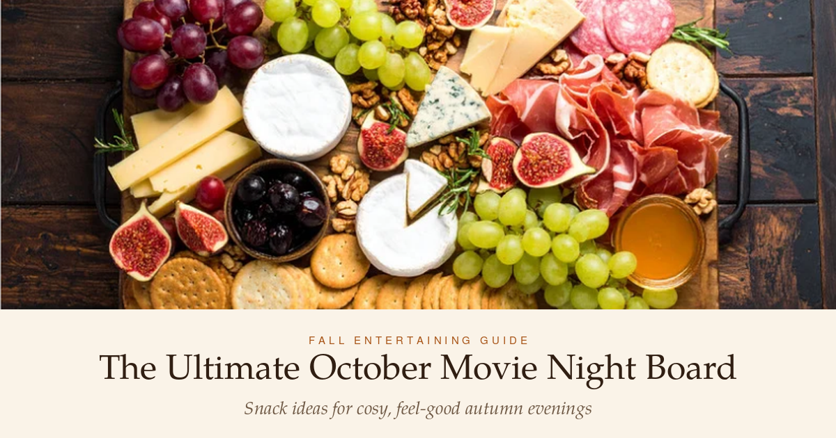Abundant charcuterie platter with fruits, nuts, and crackers titled "The Ultimate October Movie Night Board".
