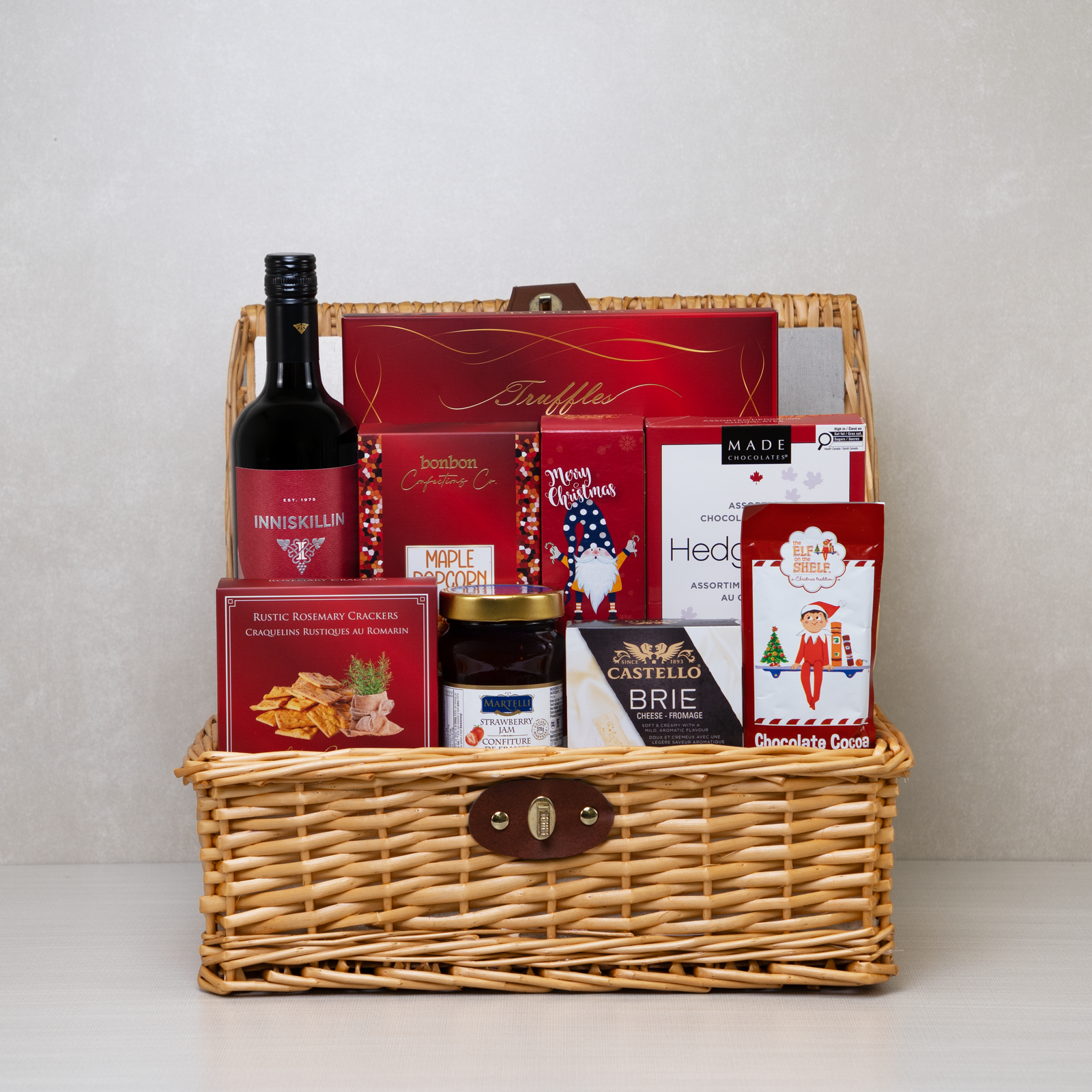 Festive Flavours Gourmet Gift Basket with Inniskillin red wine, Castello brie, maple popcorn and truffles in a wicker hamper