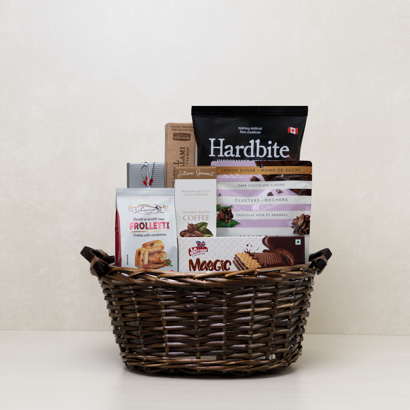 Gourmet Moments Basket, which includes wafers, chips, salami, chocolates, and more.