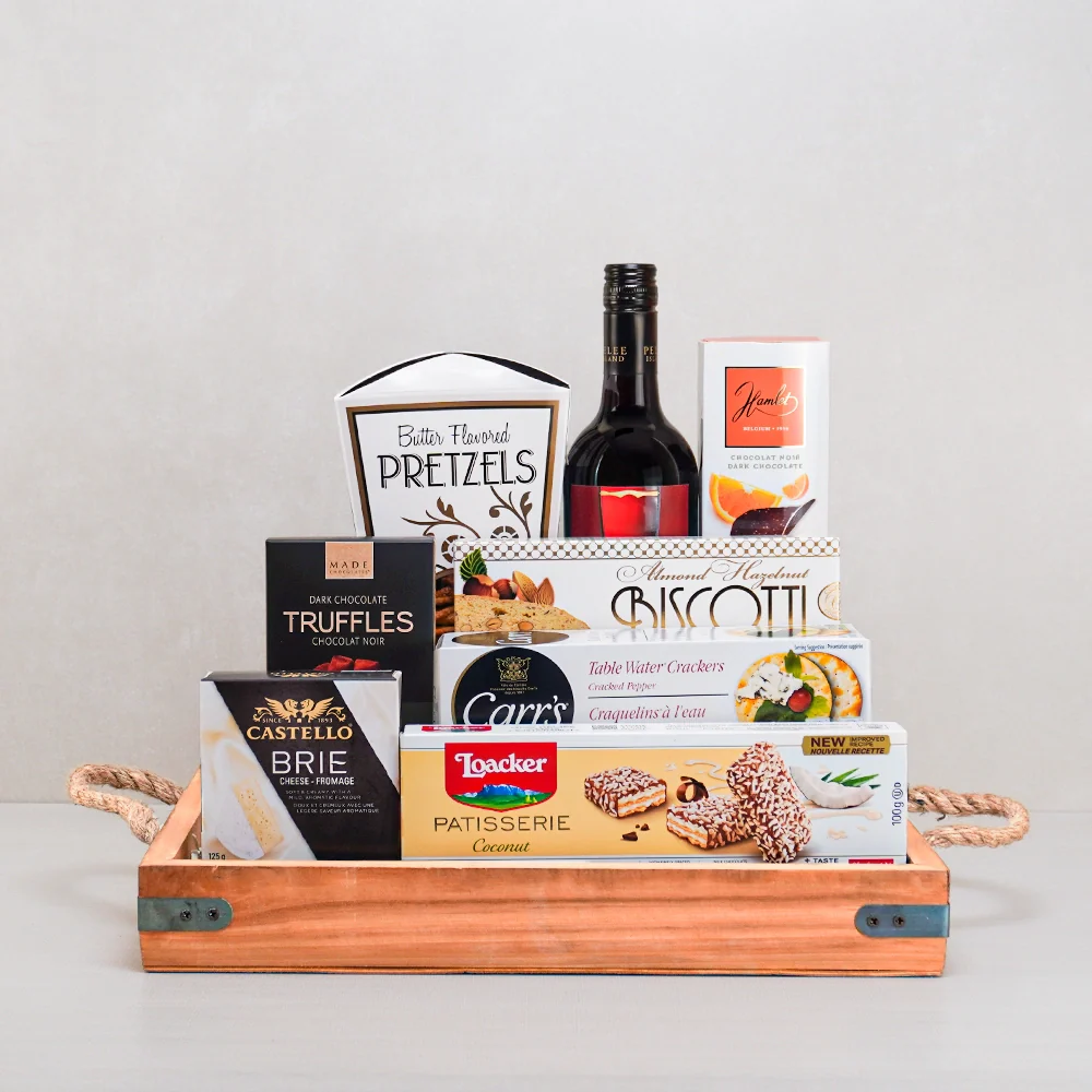 A signature Gourmet Gifts basket with artisan chocolate, gourmet snacks and preserves