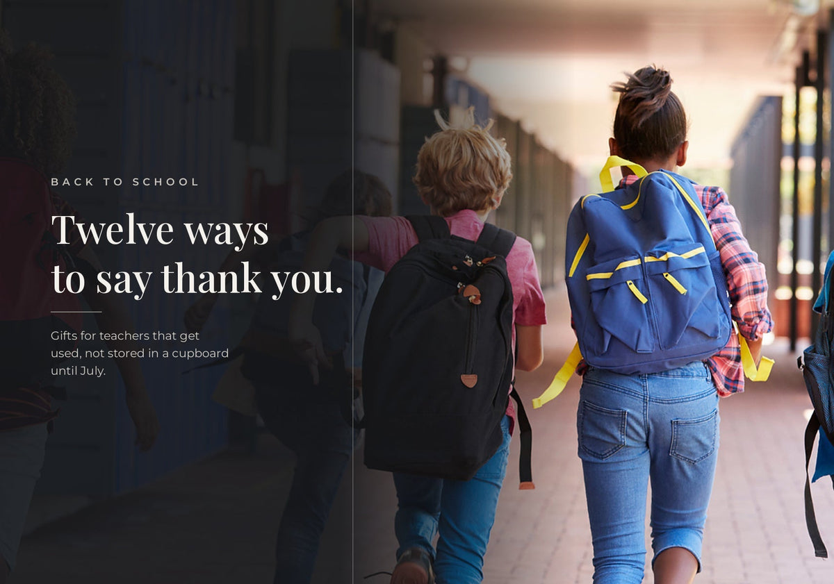 Elementary school students wearing backpacks walking down a hallway for back-to-school teacher gift ideas.