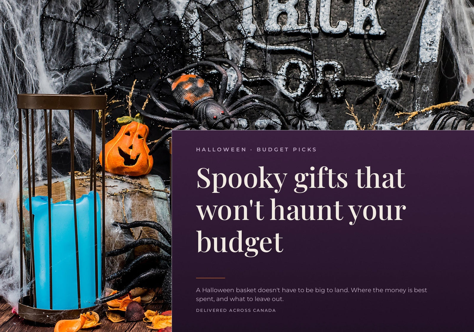 A spooky Halloween display with a glowing blue candle in a cage, a small pumpkin, and plastic spiders.