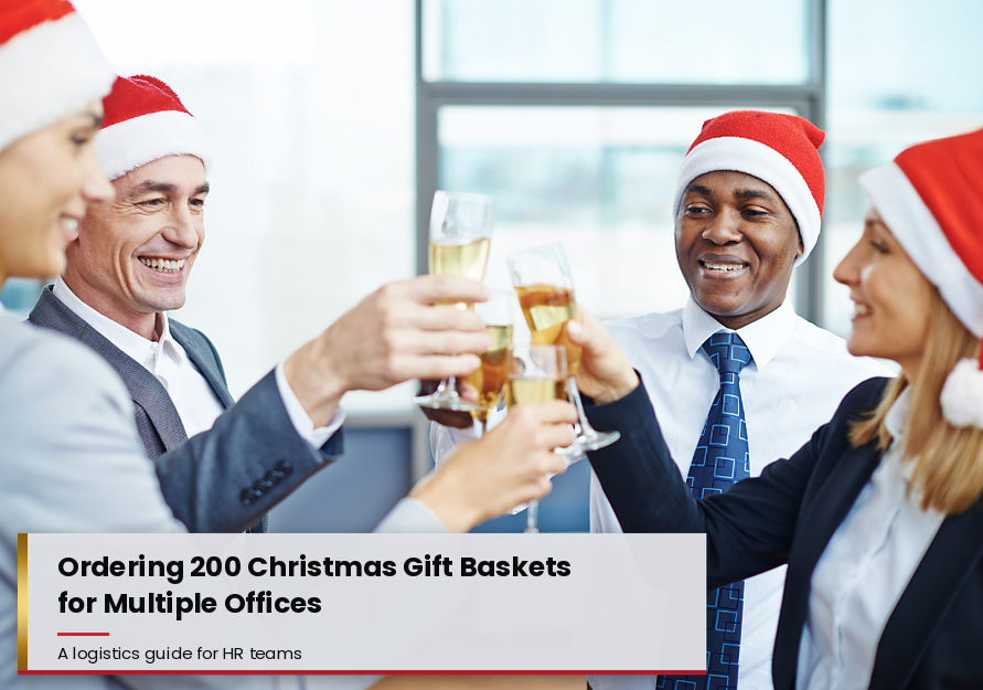 Colleagues in Santa hats toasting with champagne and text reading "Ordering 200 Christmas Gift Baskets for Multiple Offices".