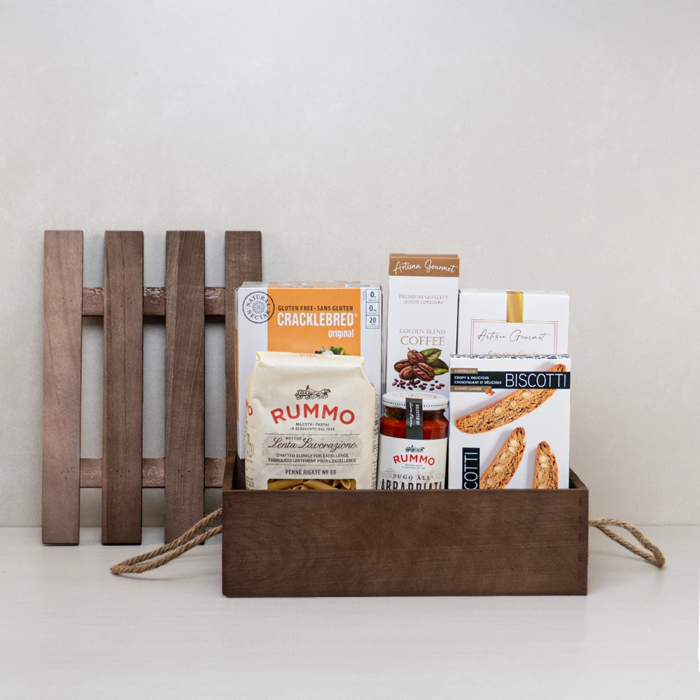 Artisan Treats Wooden Crate with Italian penne rigate, pasta sauce, almond biscotti, breadsticks and coffee in a wooden crate.
