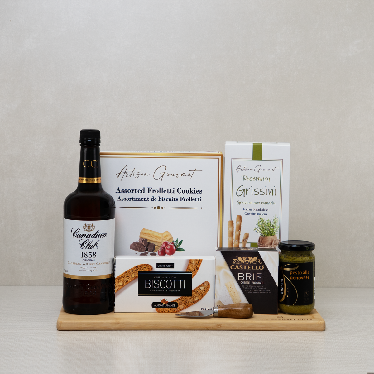Canadian Whisky Lover's Basket with Canadian Club 1858 whisky, Castello brie, almond biscotti, rosemary grissini and pesto