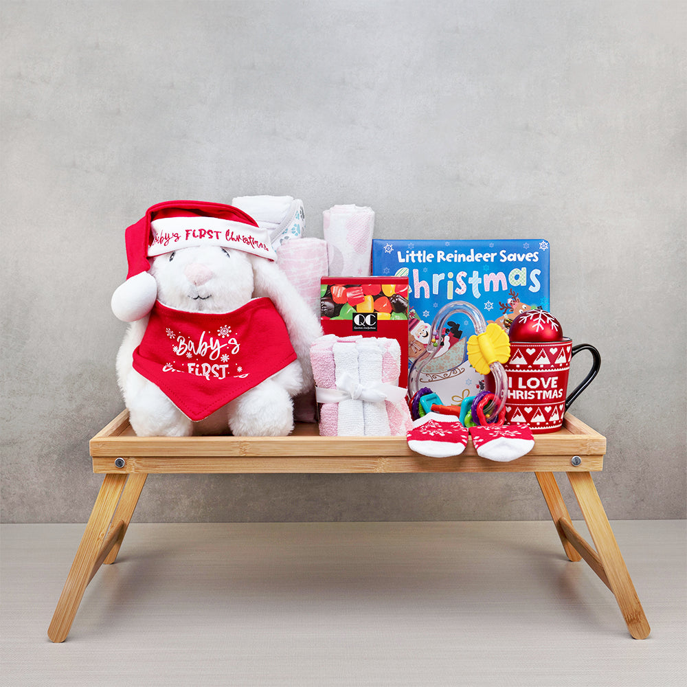 Baby’s First Christmas Bunny Bundle: plush bunny in a matching hat and bib, storybook, mug and socks on a bamboo bed tray