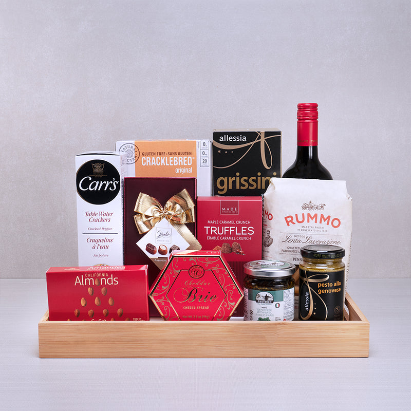 A celebration gift basket with red wine, chocolates and Italian gourmet treats