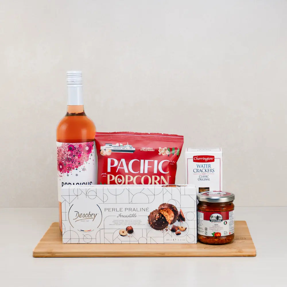 Rays of Romance Baskets with rosé wine, Pacific strawberry popcorn, Desobry praline cookies and tomato pesto on bamboo