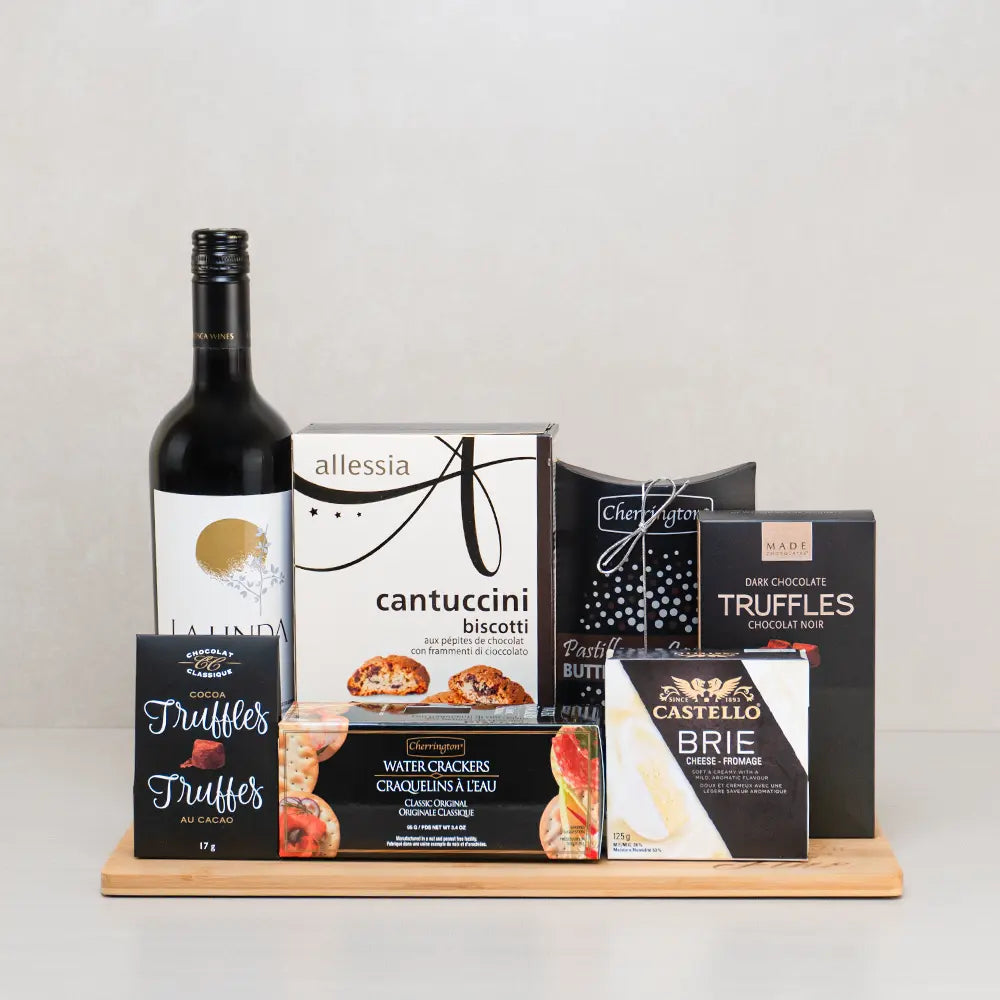 With Love & Care Gift Basket with La Linda red wine, Castello brie, chocolate chip cantuccini, water crackers and truffles