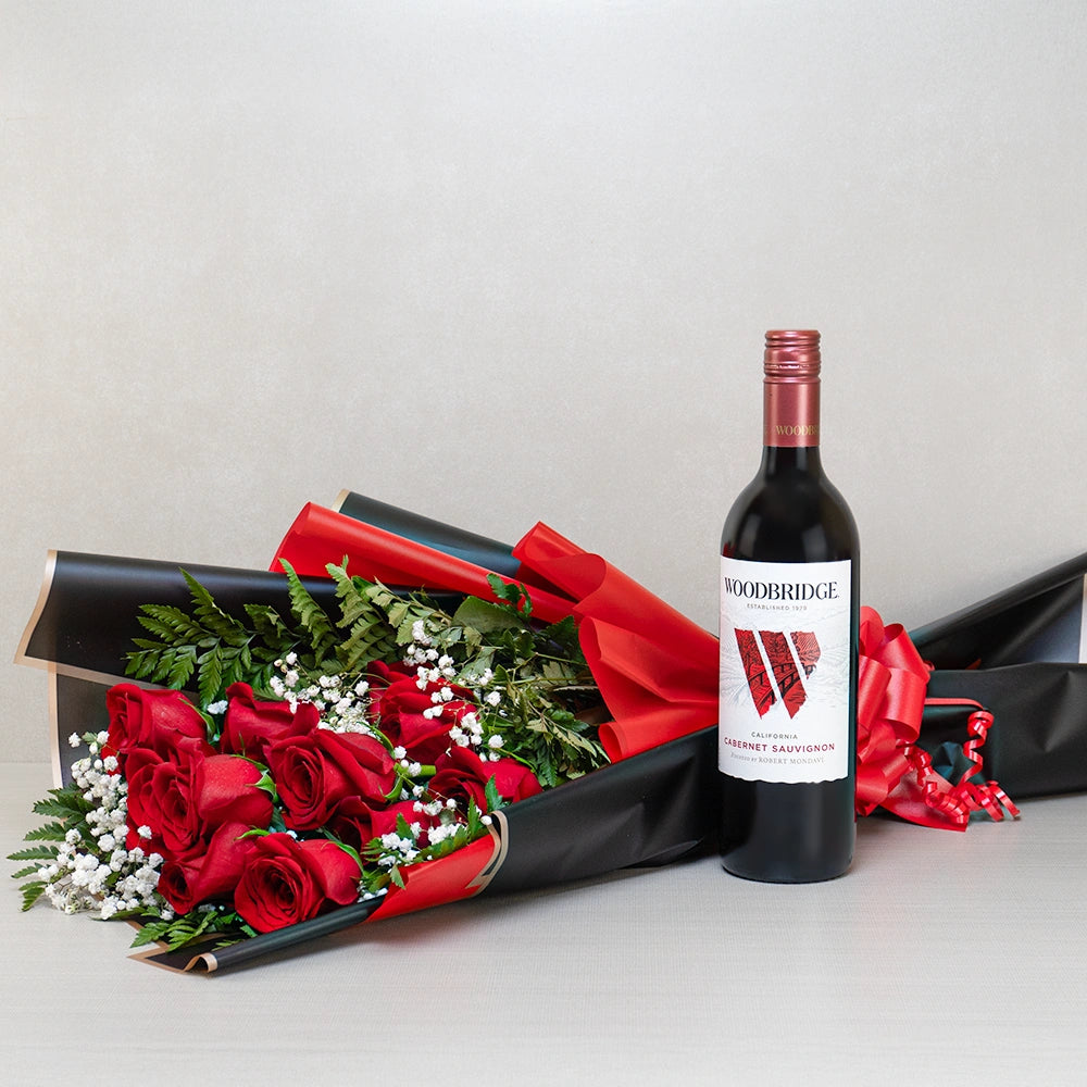 Midnight Rose & Cabernet Bliss gift set: Woodbridge Cabernet Sauvignon with red roses and baby's breath in black and red wrap