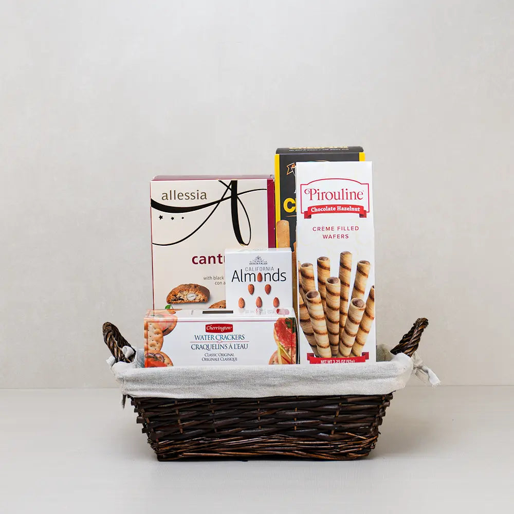 Healing Touch Gourmet Basket with Pirouline wafers, black cherry cantuccini, almonds and water crackers in a willow basket