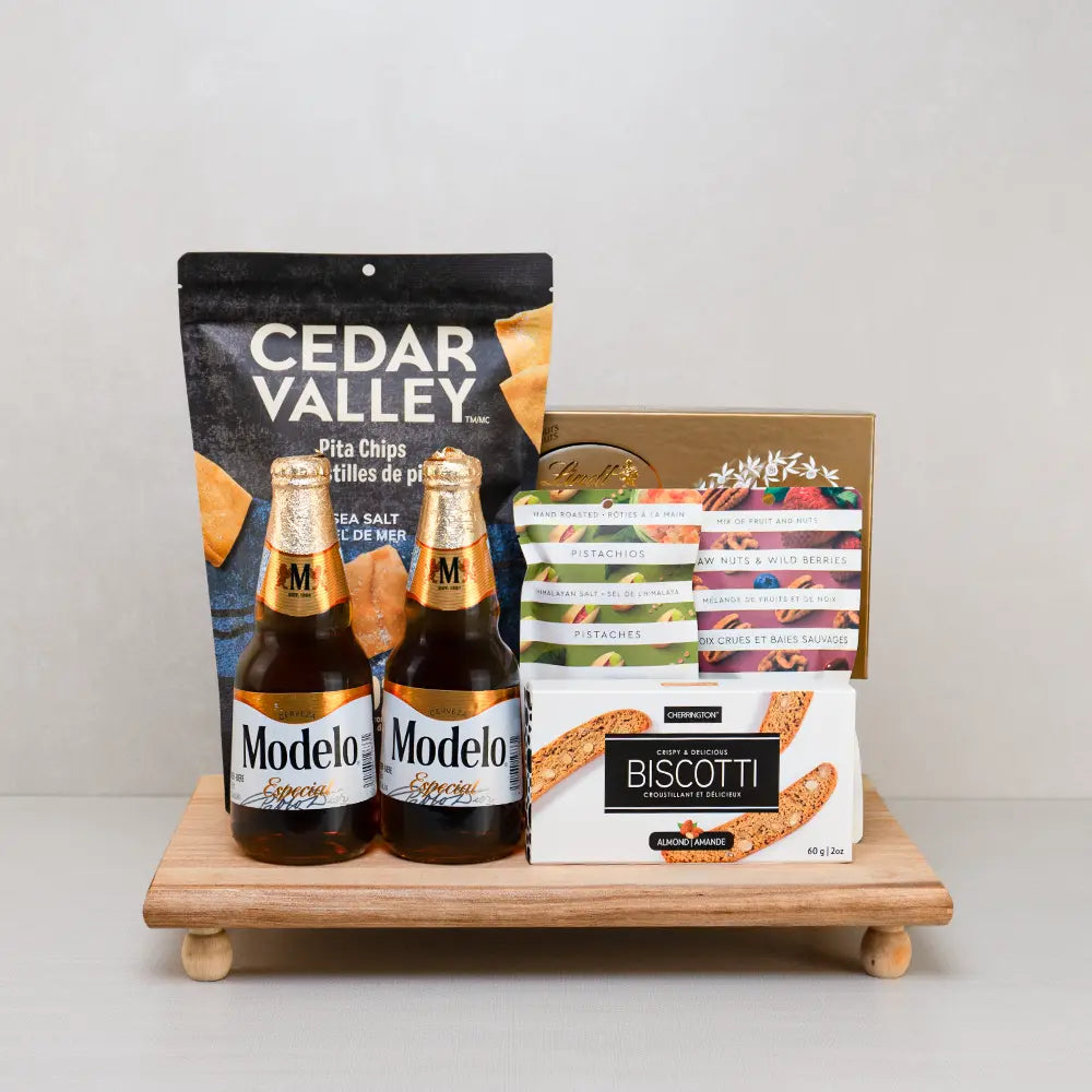 Weekend Wind Down gift tray with two Modelo Especial beers, Cedar Valley pita chips, Lindt chocolates and almond biscotti