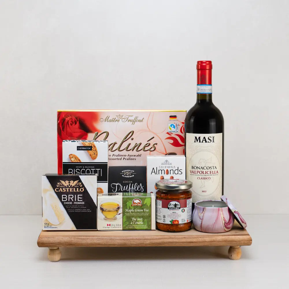 Wine, Love & Little Luxuries gift basket with Masi Valpolicella, rose pralines, Castello brie, maple green tea and a candle