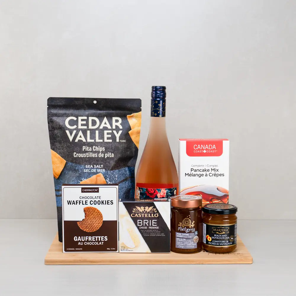 Luxury Mother’s Day Gift Basket with rosé wine, Cedar Valley pita chips, Castello brie, pancake mix and honey on bamboo