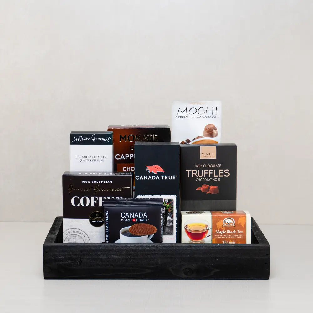 The Grand Brew Mother’s Day Gift Basket with Colombian coffee, Mokate cappuccino, maple tea and truffles on a black wood tray