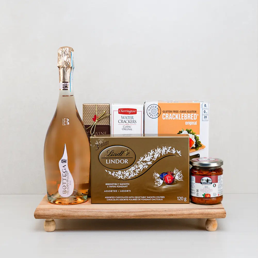 Sparkling Love Mother’s Day Hamper with Bottega rosé Prosecco, Lindt Lindor, ice wine chocolate and pesto on a footed board