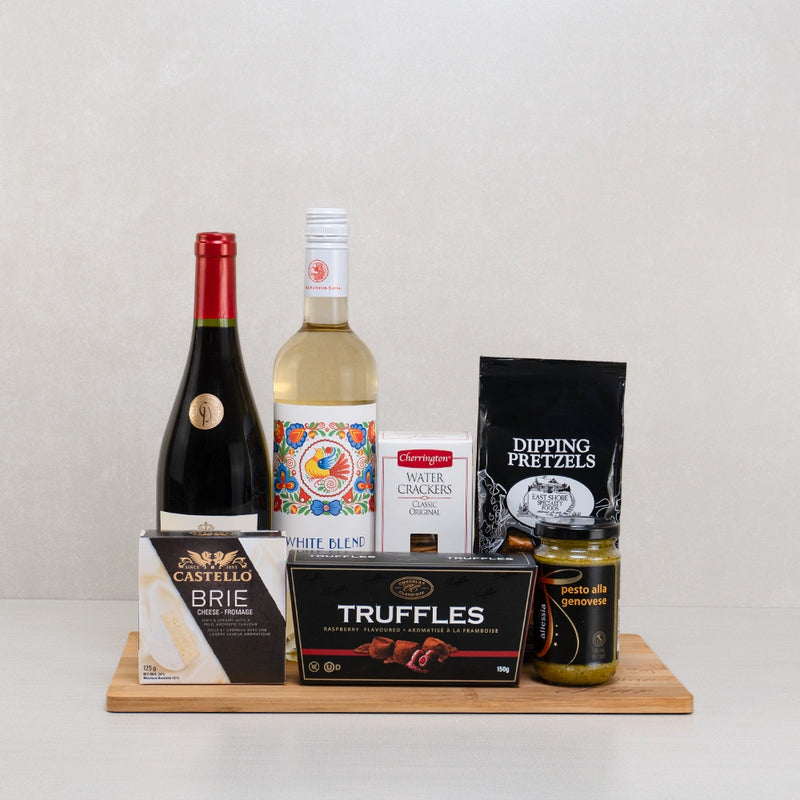 A wine duo gift board with truffles, pretzels and pesto
