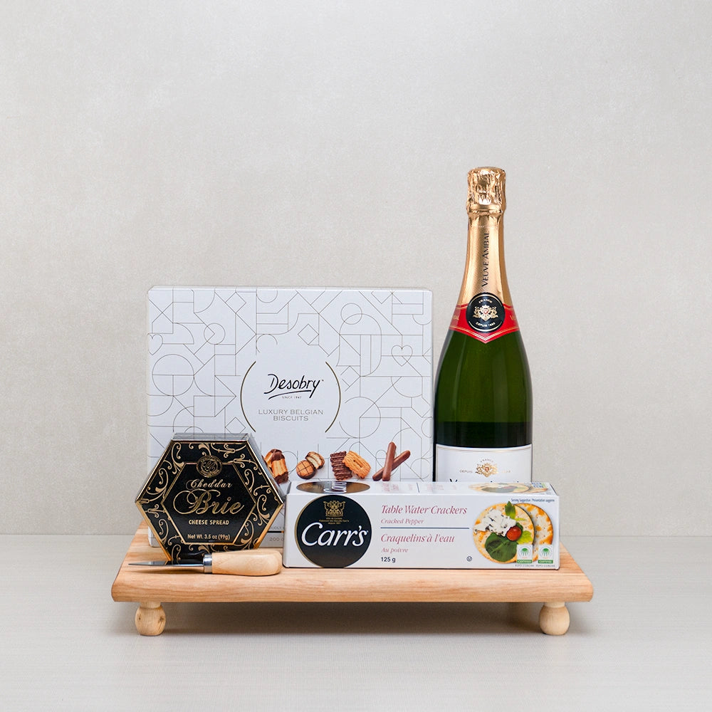 Luxury Bites with Bubbly gift set: sparkling wine, Desobry biscuits, Carr's crackers and cheddar brie spread on a footed tray