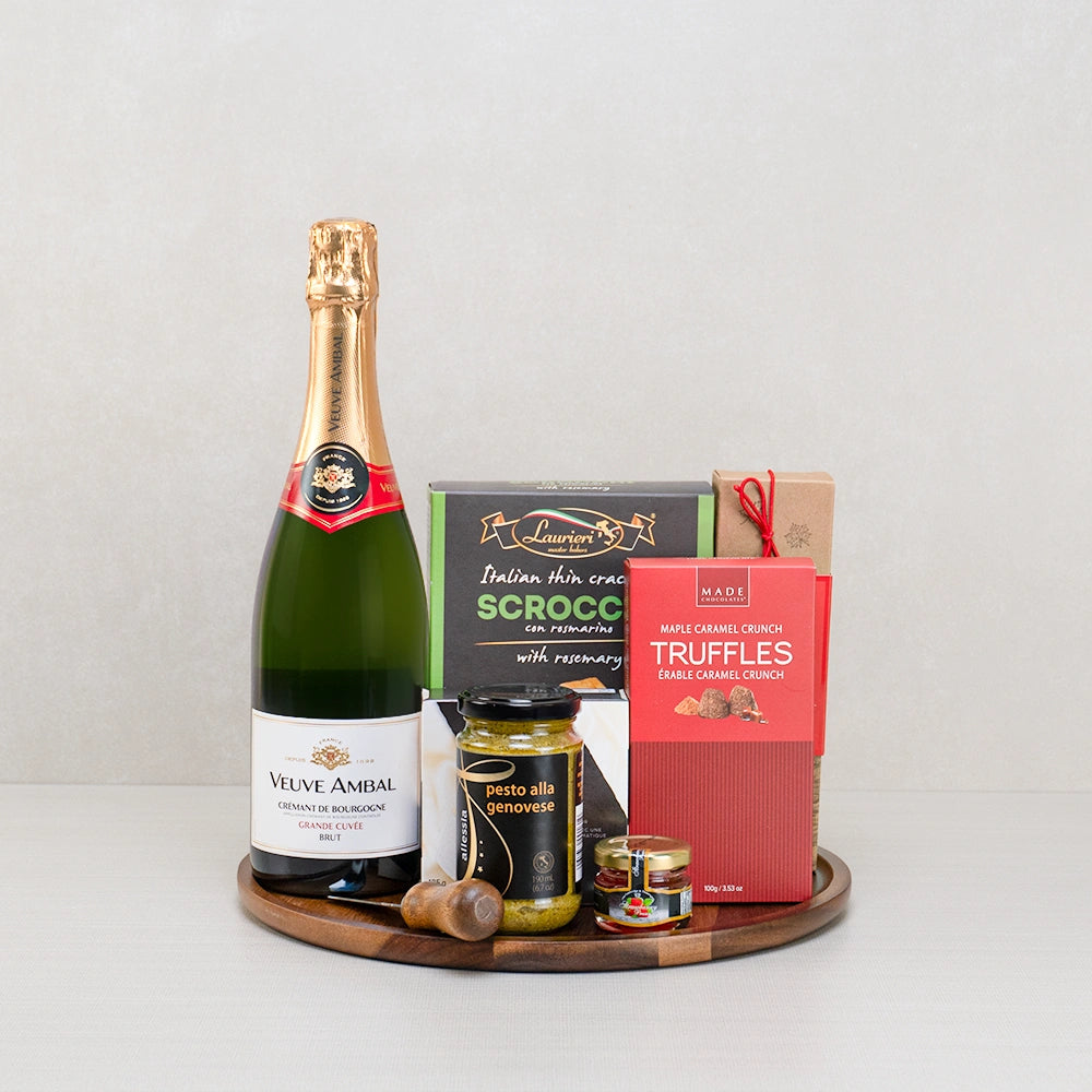 Veuve Ambal Celebration Basket with Crémant de Bourgogne, Scrocchi crackers, maple truffles and pesto on a round board