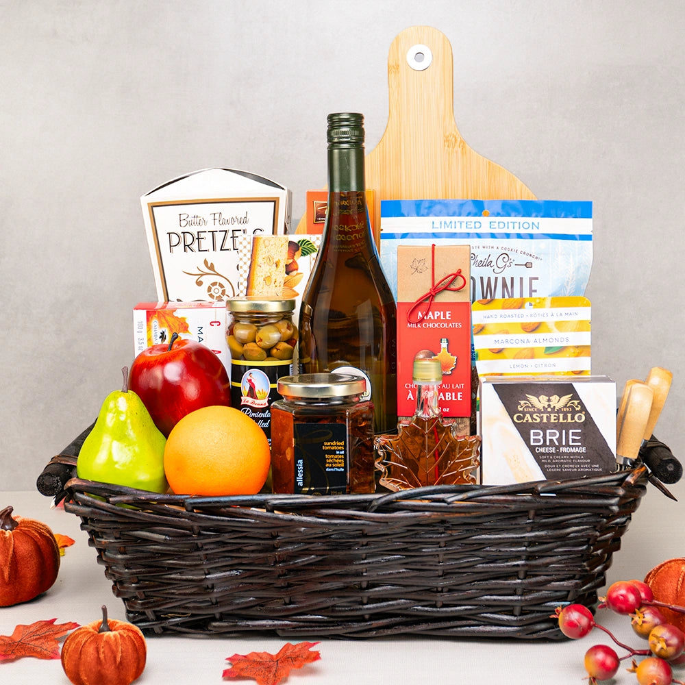 Seasonal Splendor Gourmet Basket with white wine, an apple, orange and pear, Castello brie, maple syrup and cheese knives