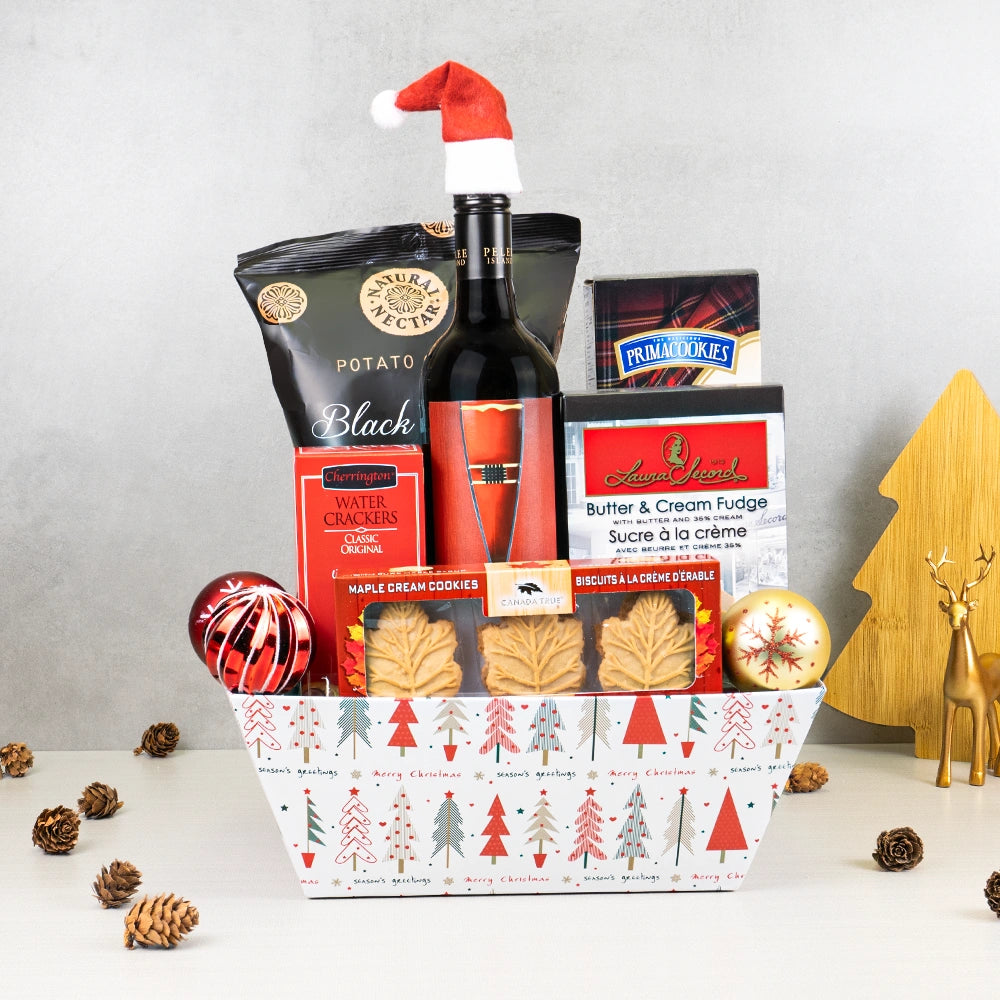Winter Wonderland Snack Basket with red wine in a Santa hat, Laura Secord fudge, maple cream cookies and black truffle chips
