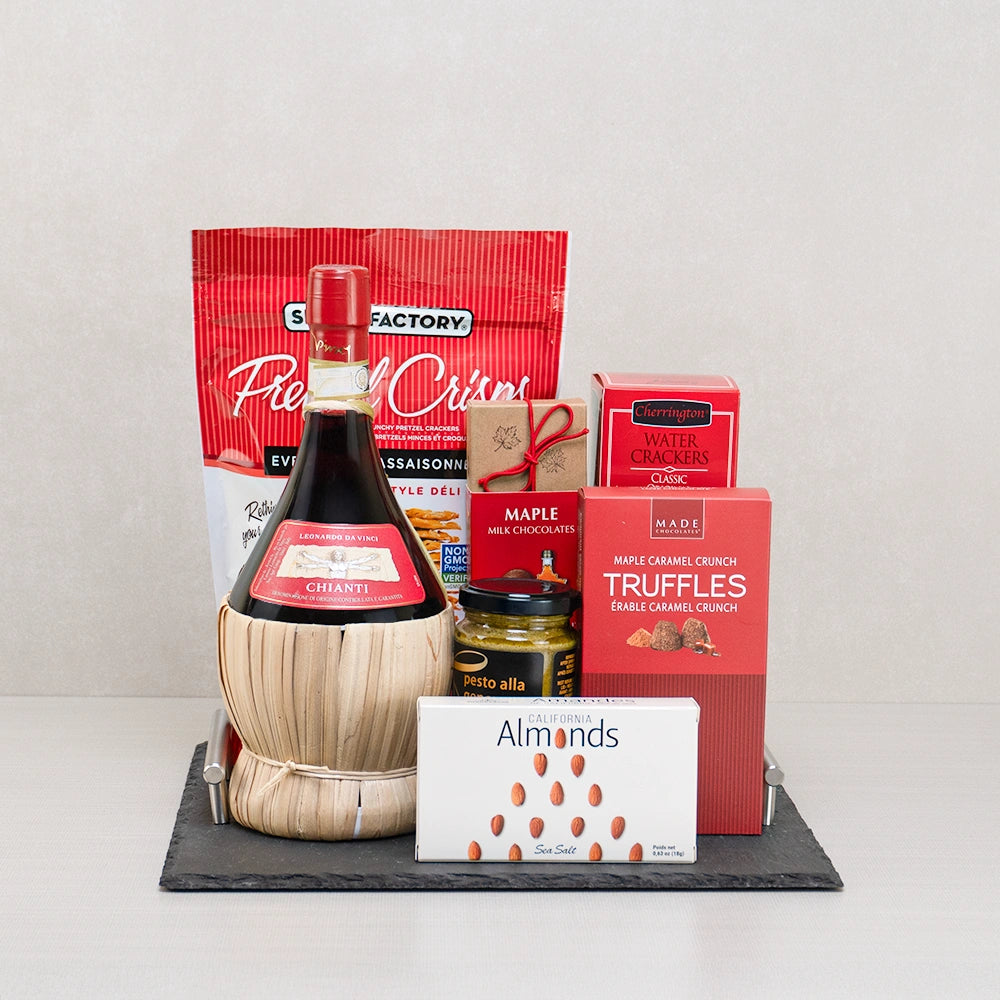 True North Indulgence Gift Set with Chianti in a straw fiasco, Pretzel Crisps, maple truffles and almonds on a slate tray