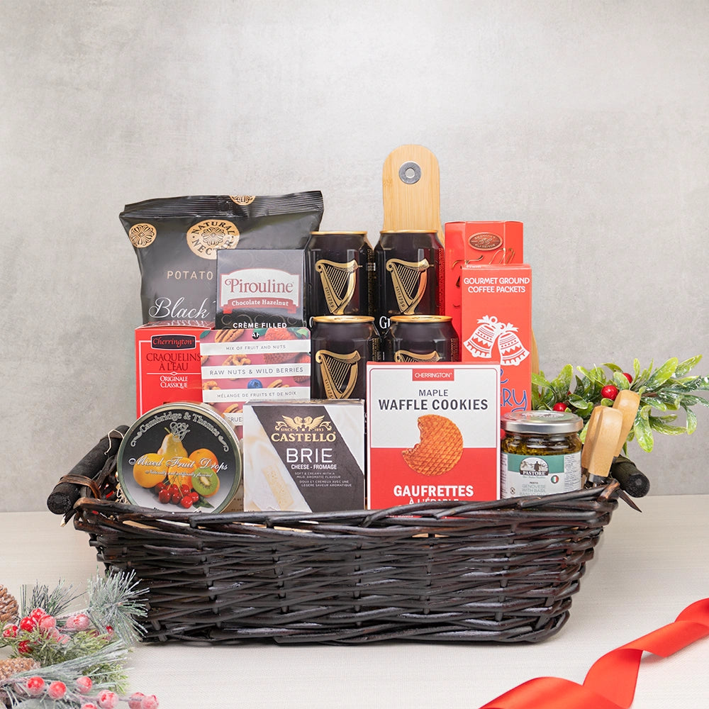 Ultimate Beer & Treats Collection with four Guinness cans, Castello brie, truffle chips and cheese knives in a wicker basket