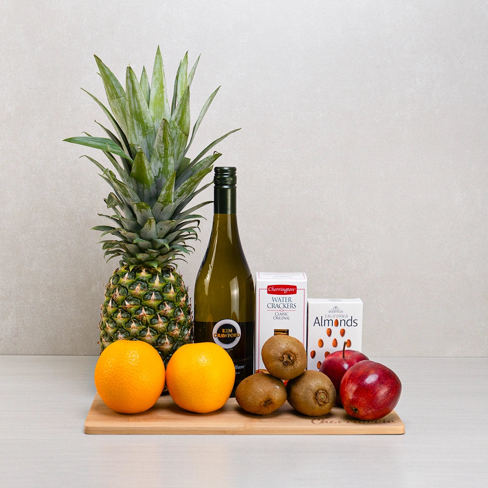 Sparkling Harvest Fruit & Gourmet Treats gift set: Kim Crawford Sauvignon Blanc, a pineapple, oranges, kiwis and red apples