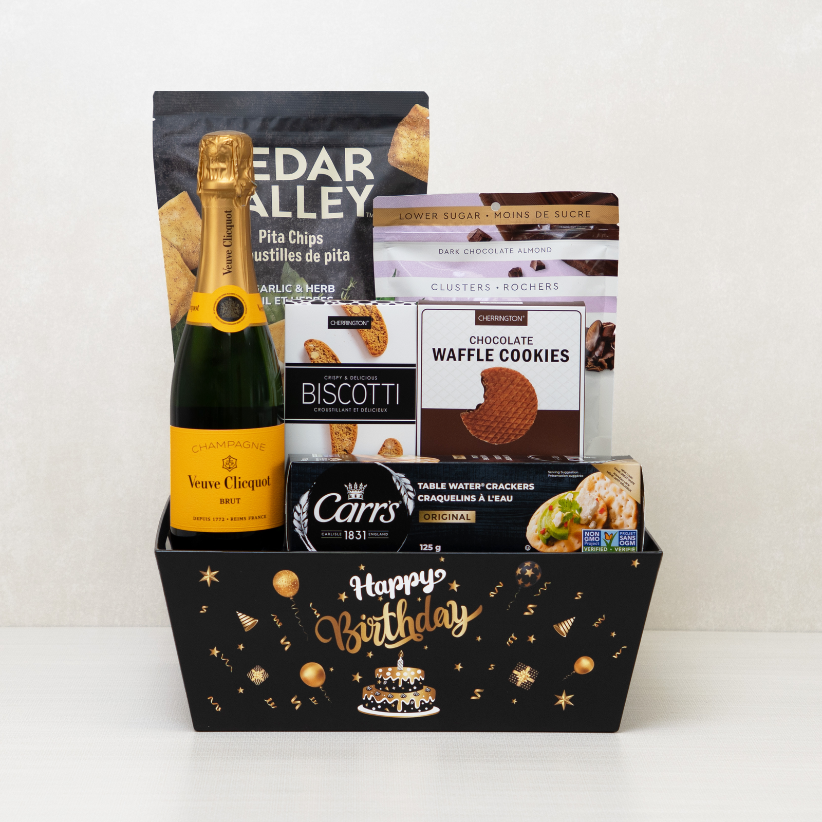 Pop the Bubbly Birthday Basket with champagne, biscotti, water crackers, cookies, chocolate almond clusters, and chips.