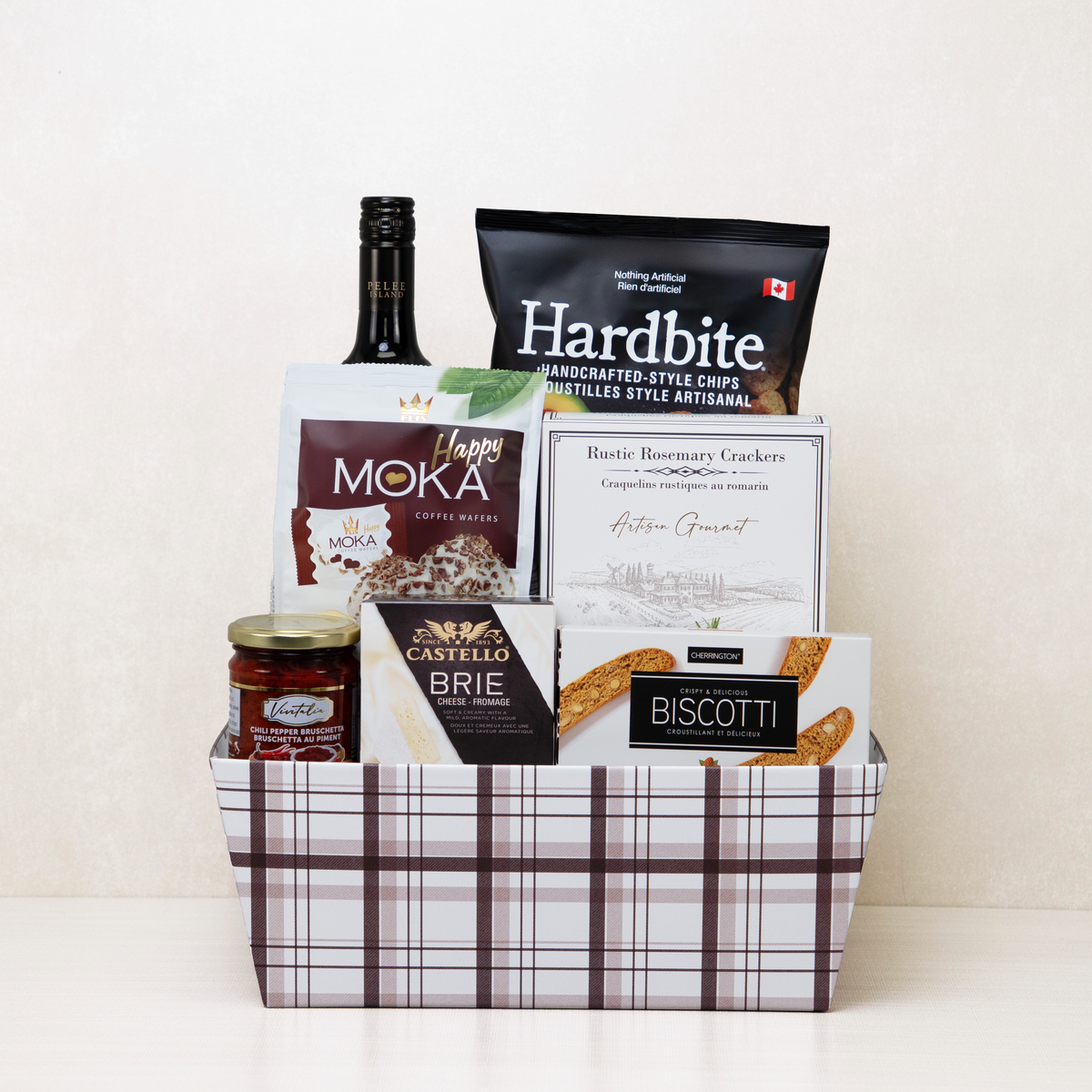 Prestige Corporate Basket with Pelee Island red wine, Castello brie, Hardbite chips and Happy Moka wafers in blush plaid