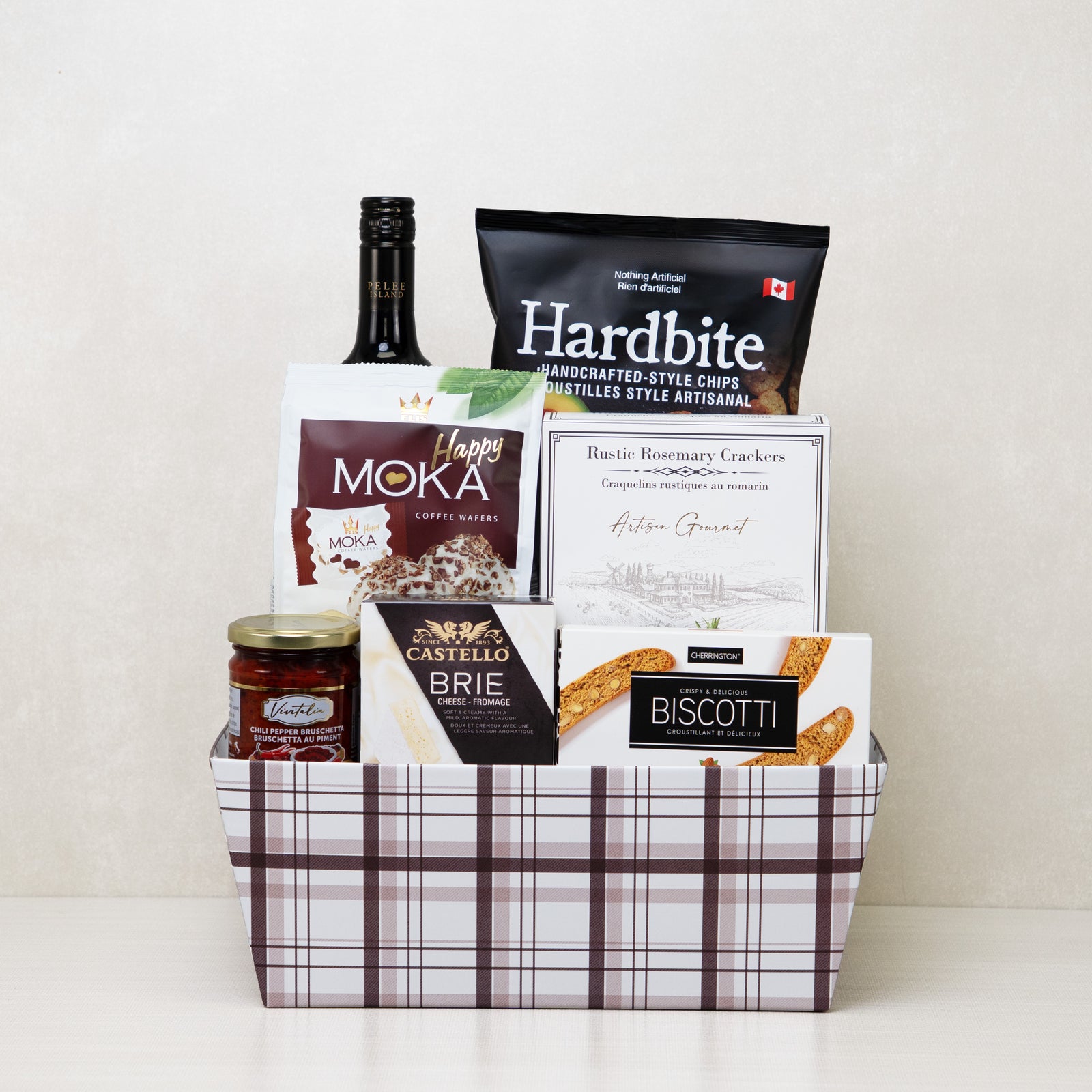 Prestige Corporate Basket with red wine, brie cheese, chips, crackers, pesto, and more.