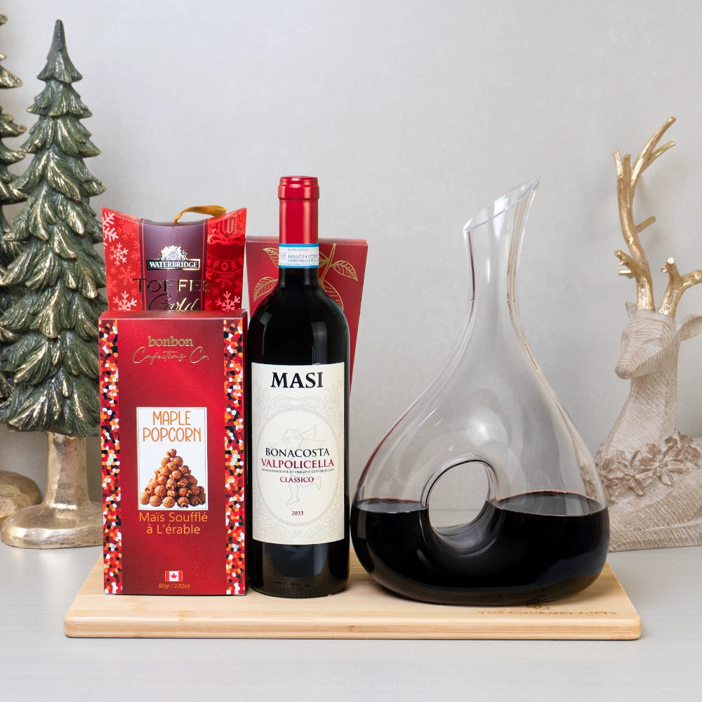 Red Wine Indulgence Set with Masi Valpolicella, an infinity loop glass decanter, maple popcorn and toffee on a bamboo board