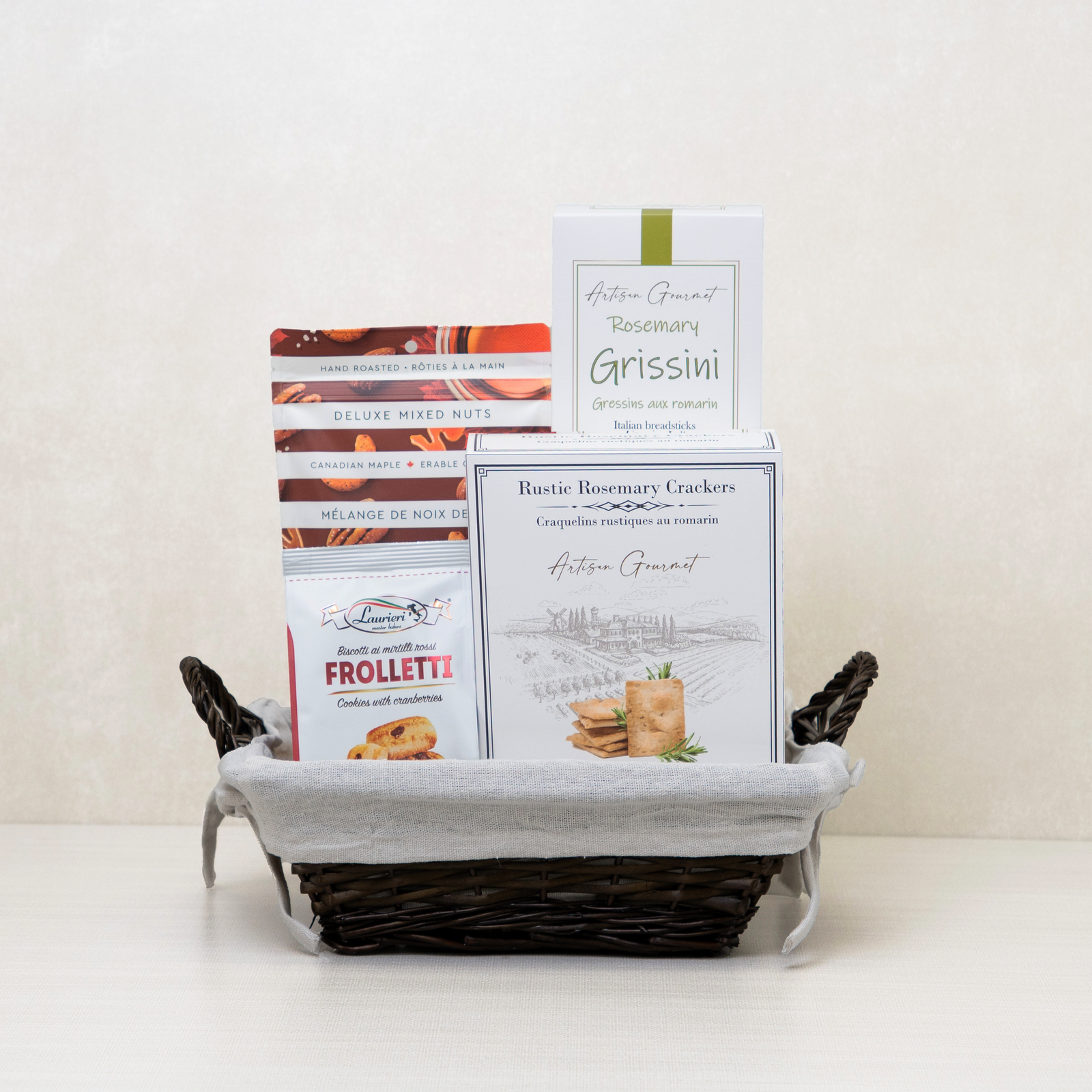 Rustic Gourmet Basket: Rosemary breadsticks, crackers, mixed nuts, and cranberry cookies in a willow basket.