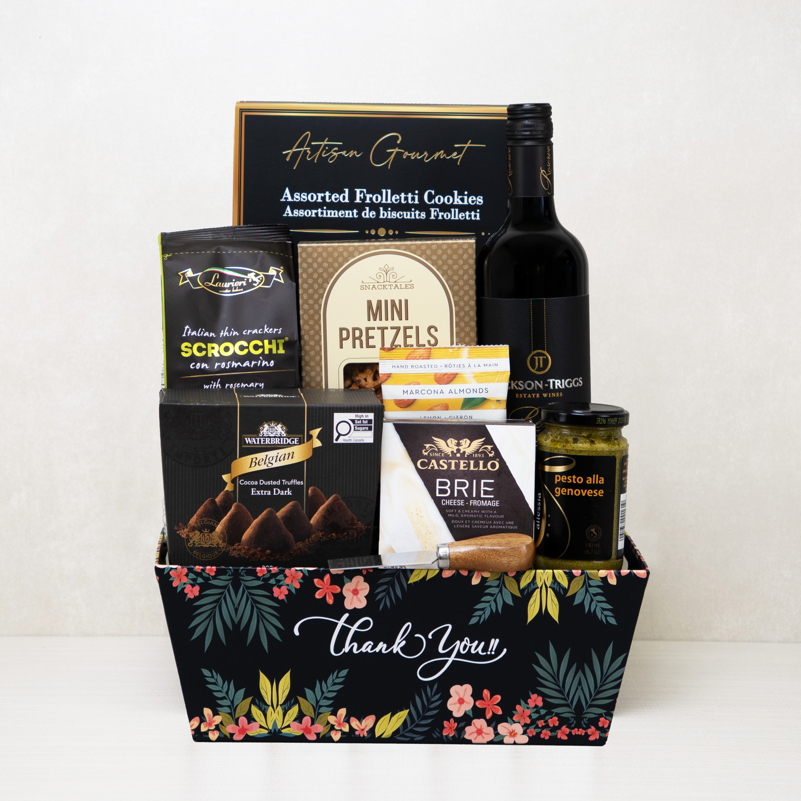 Signature Thank You Basket with red wine, brie cheese, truffles, crackers, and more in a decorative keepsake basket.