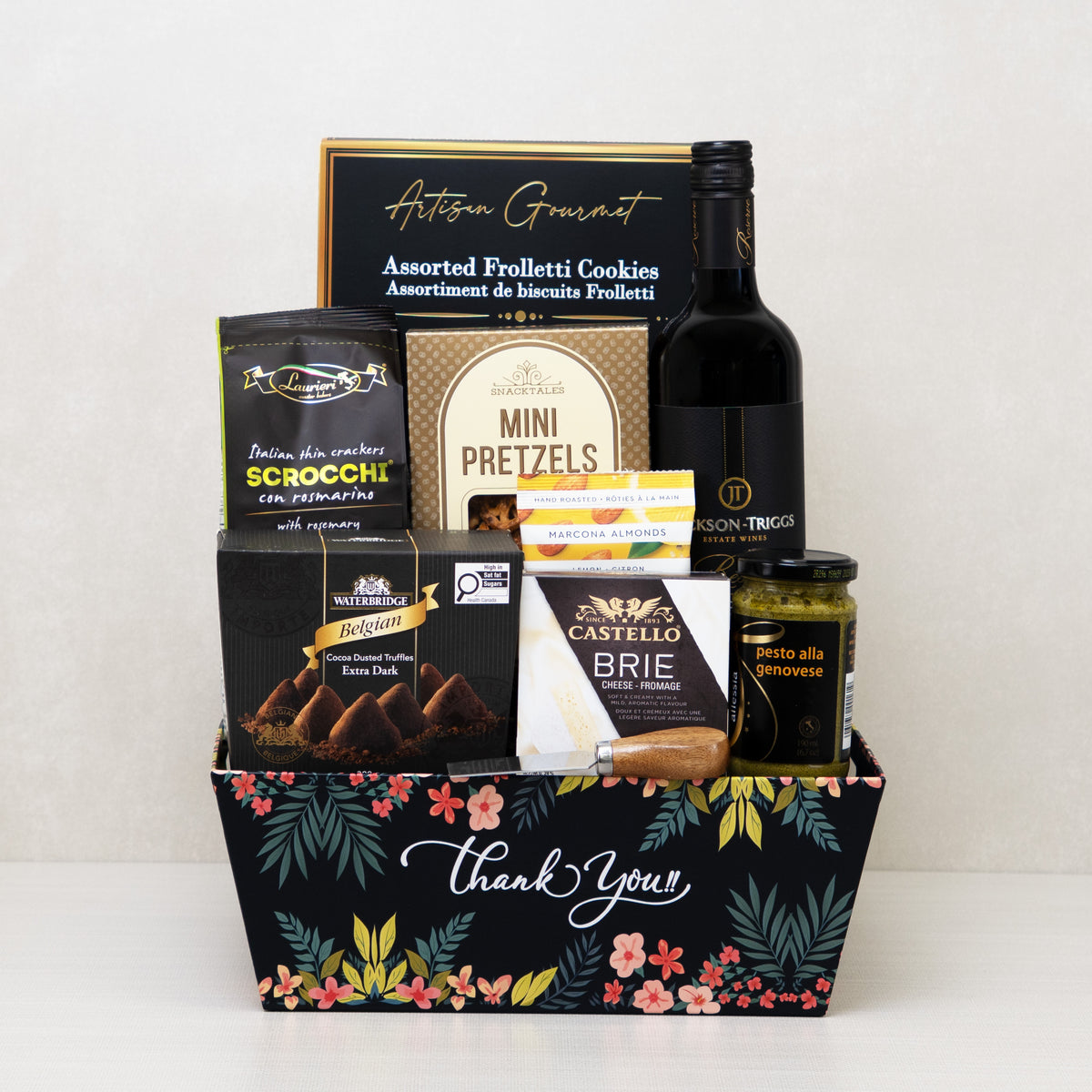 Signature Thank You Basket with red wine, brie cheese, truffles, crackers, and more in a decorative keepsake basket.