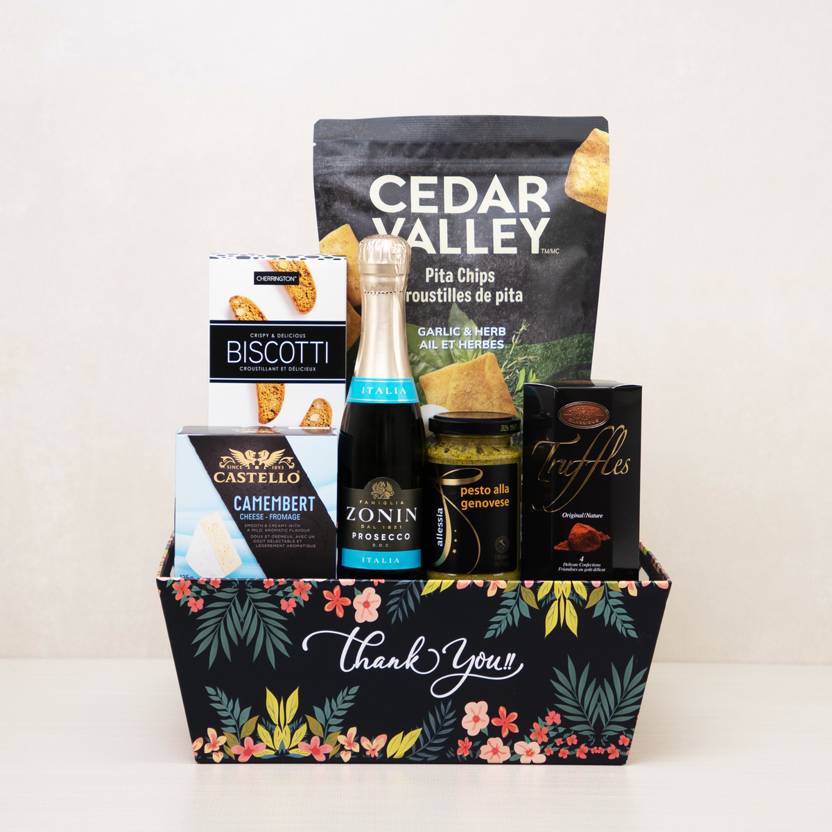 Thank You Gift Basket printed with flowers, holding mini Zonin Prosecco, Castello Camembert, biscotti, pita chips and pesto