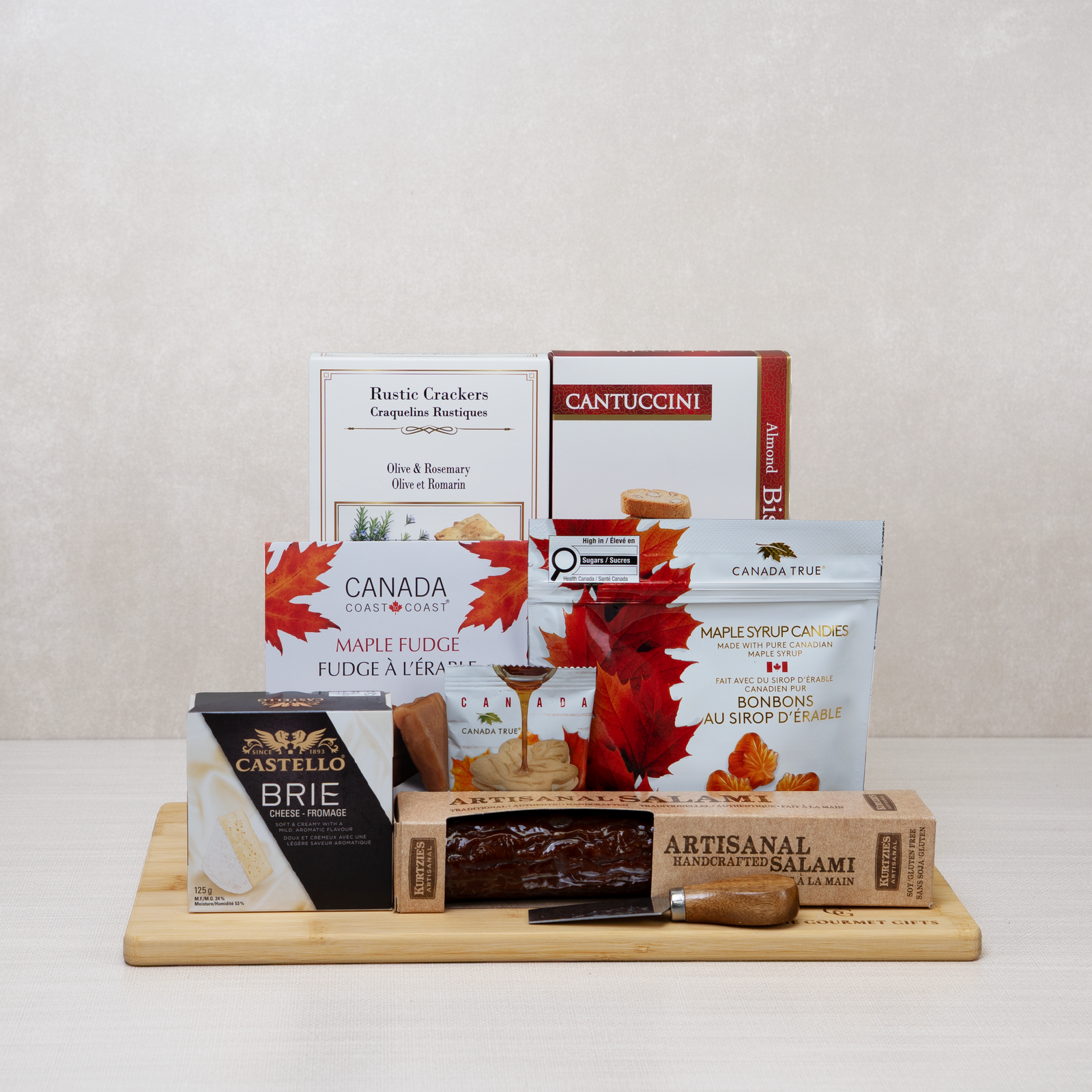 Thanksgiving Gathering Gift Basket with brie, salami, crackers, cheese knife, maple candies, fudge & biscotti.
