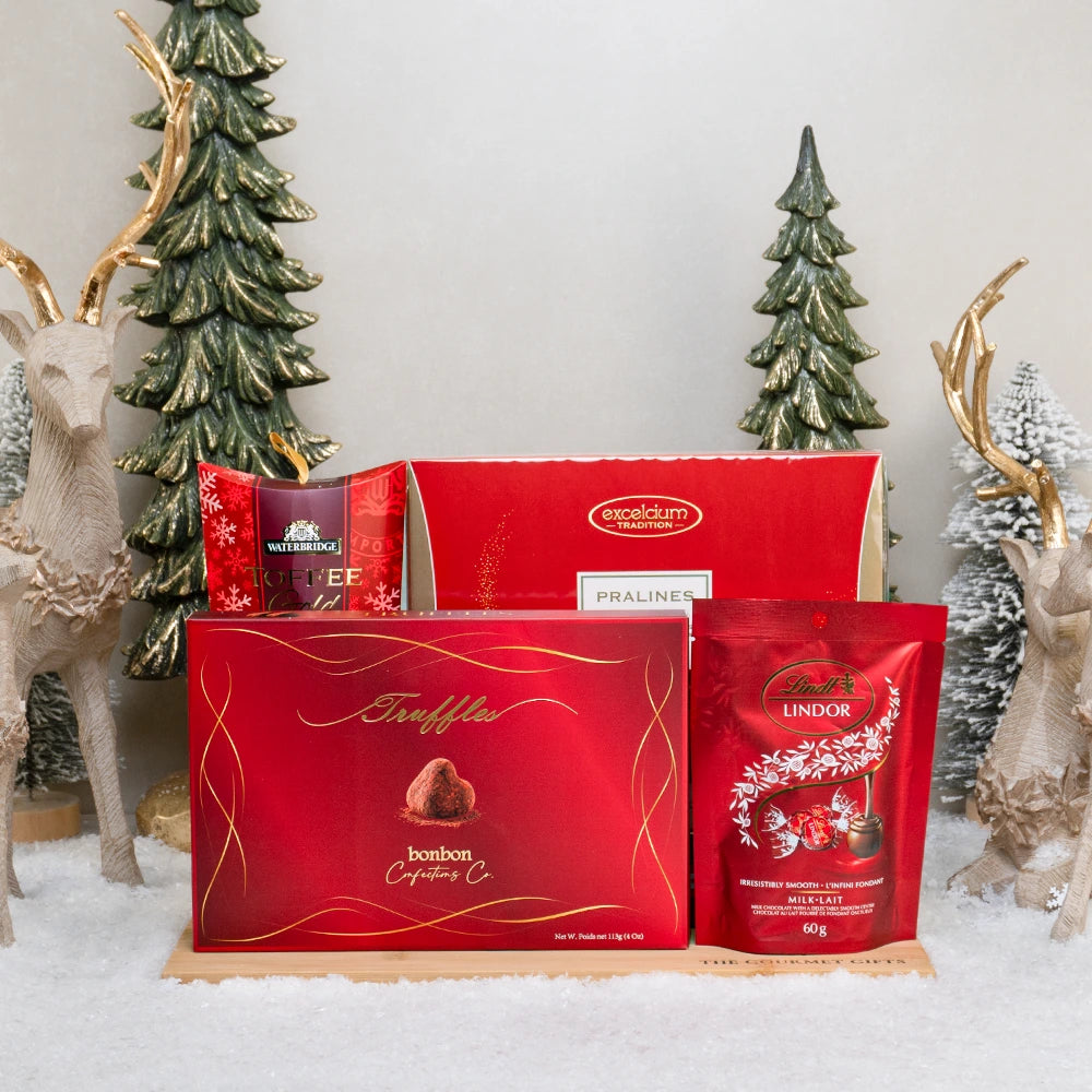 The Platinum Feast gift set with Excelcium pralines, Lindt Lindor, bonbon cocoa truffles and Waterbridge toffees on a board
