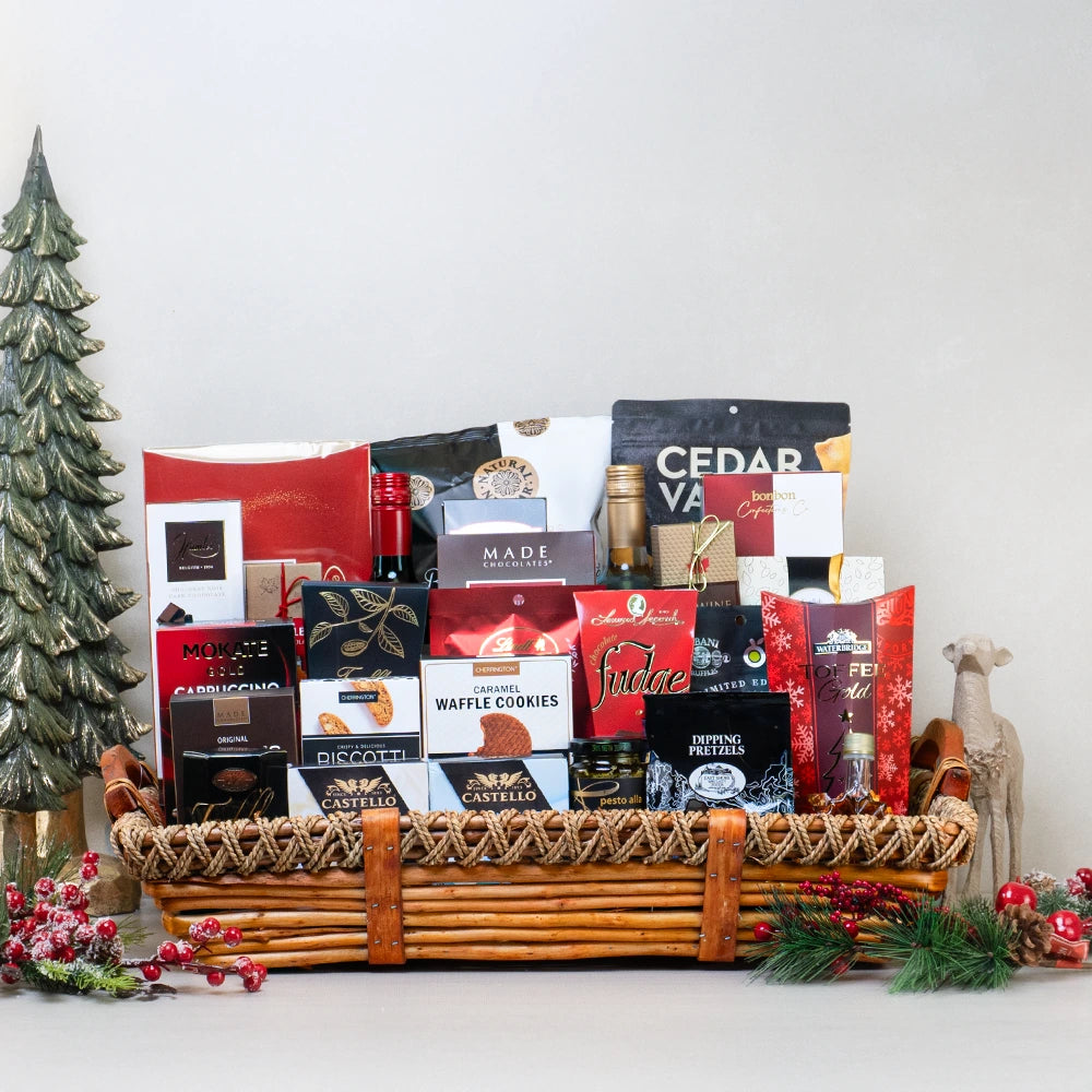 Christmas gift basket includes wines, cheese, biscotti, cookies, chocolates, pretzels, truffles, chips, popcorn, pesto, syrup and more with Canada-wide delivery.