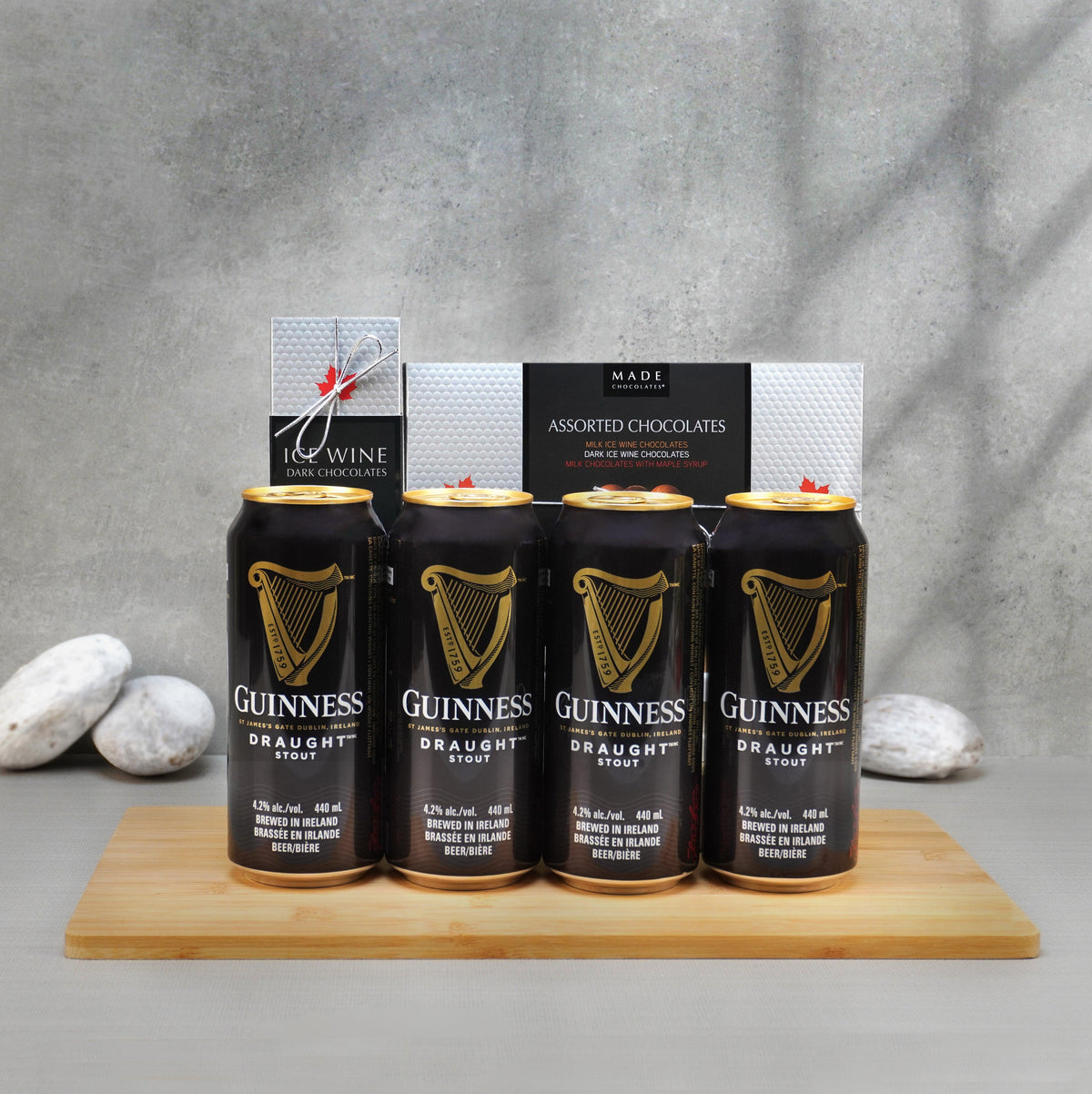 Beer & Delights Gift Set with four Guinness Draught cans, Made ice wine chocolates and a Made assortment on a bamboo board
