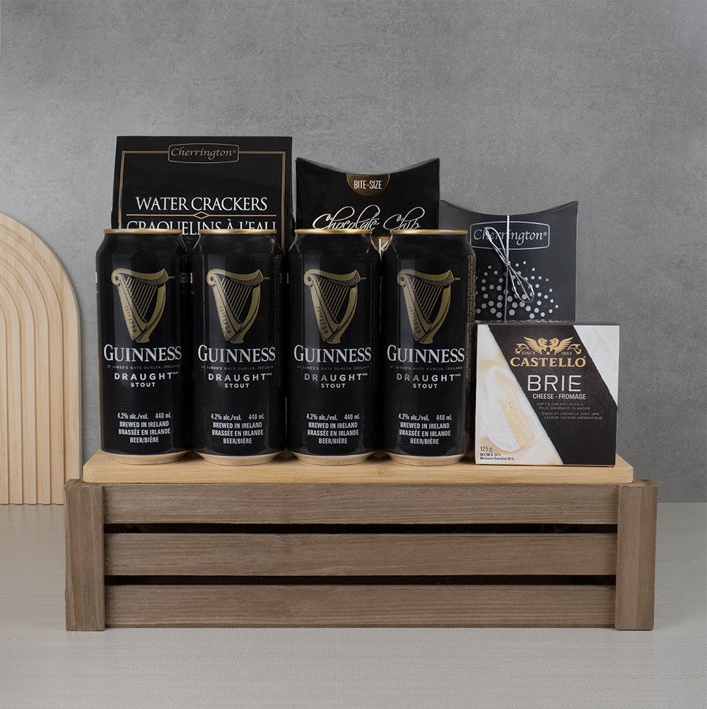 Guinness & Brie Royal Gourmet Collection: four Guinness Draught cans, Castello brie and water crackers on a wooden crate