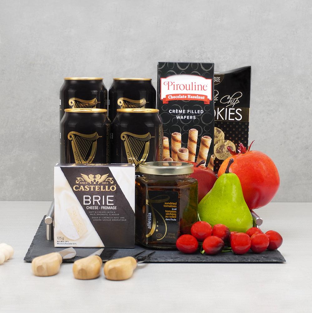 Let's Celebrate Beer Gift Basket with four Guinness cans, Castello brie, Pirouline wafers and fresh fruit on a slate tray