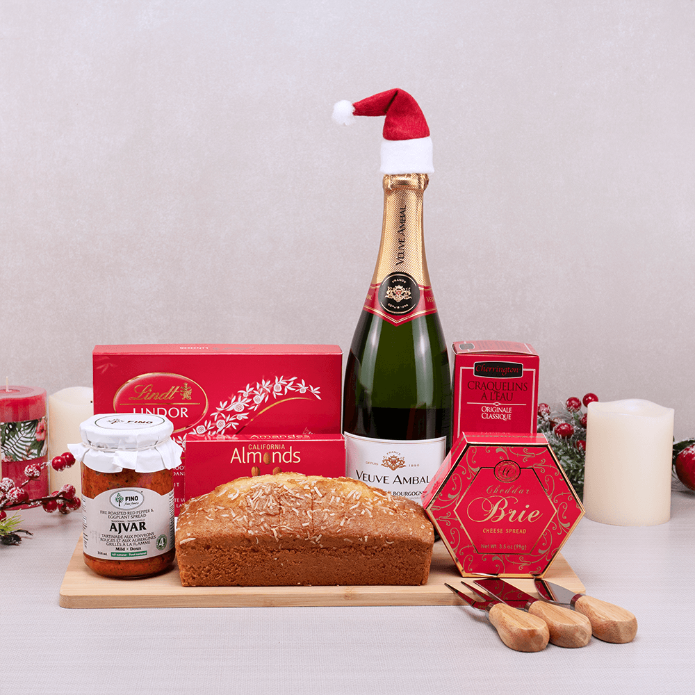 Merry Christmas Celebration Gift Set with Veuve Ambal in a Santa hat, Lindt Lindor, coconut pound cake and cheese knives