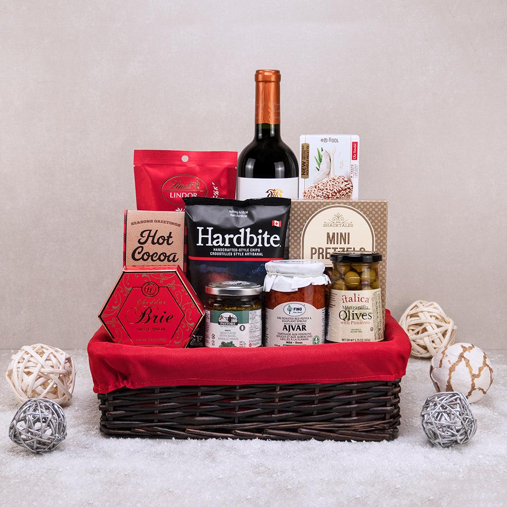 Taste of Tuscany Basket, dark wicker with a red liner, holding red wine, Lindt Lindor, Hardbite chips, ajvar and olives
