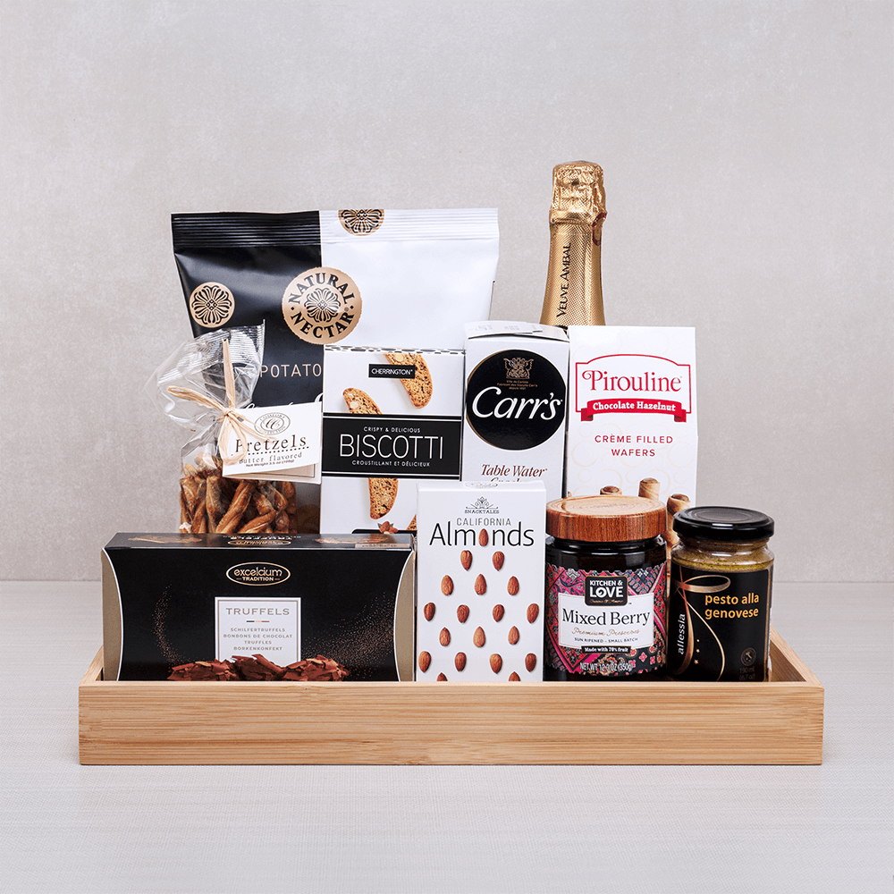 The Imperial Champagne Experience gift set with sparkling wine, Excelcium truffles, Pirouline wafers and pesto on a tray